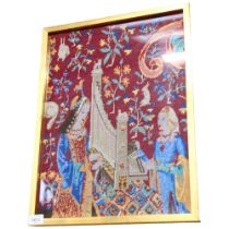 A tapestry depicting 2 ladies, 52cm x 40cm overall, framed