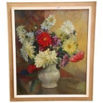 An unsigned oil on canvas, flowers in a vase sitting on a kitchen table, framed, 71cm x 60cm