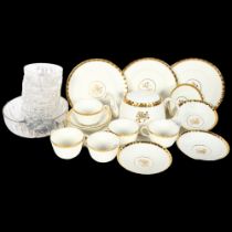A Minton "gold rose" part tea set and dinner service, including 5 tea cups and saucers, teapot and