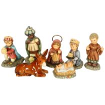 A group of Goebels Nativity figures, tallest Melchoir 16cm (crack to base), and a porcelain donkey