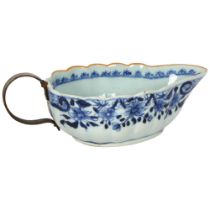 A 19th century Chinese blue and white sauce boat, 22cm Original handle has broken off with a