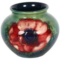 MOORCROFT - a small anemone decorated tube-lined pot, H7cm There is a crack running around the