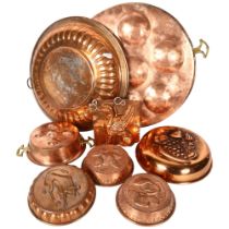A quantity of various Vintage French copper cake and jelly moulds, largest diameter 37cm