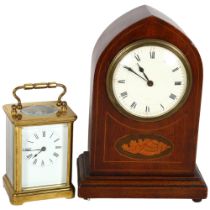 A brass carriage clock, and an Edwardian inlaid lancet-top mantel clock, 22cm