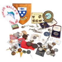 A large quantity of fishing related items, including various plaques, commemorative medals and