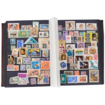 An album of UK and worldwide stamps, to include Hong Kong, Indian, Yemen, Roumania etc