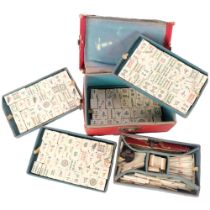 A 20th century Chinese bone and bamboo Mahjong set, complete with collection of bone sticks etc,