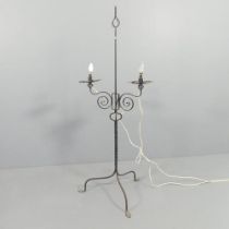 An early 20th century wrought iron candelabra with rise and fall mechanism, converted to electric.