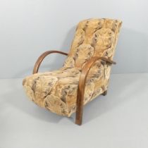 An original Art Deco Heals design Banana lounge chair with bent wood arms, retaining original
