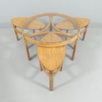 NATHAN FURNITURE - A mid-century teak circular glass-top Trinity coffee table with three oval