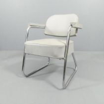 A mid-century tubular steel armchair with cantilever back.