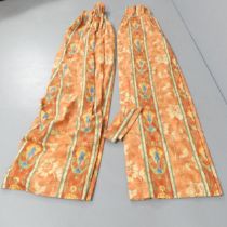 A modern pair of peach and red floral design curtains, lined, with matching ties. Drop 225cm,