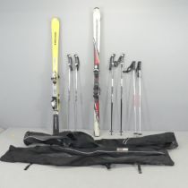 Two pairs of skis, by Head and Rossignol, and three pairs of poles, with carrying bags.