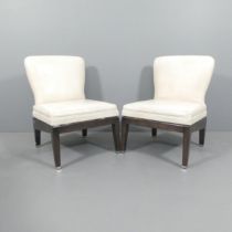 A pair of high end contemporary design slipper chairs in patterned leather with chrome detailing,