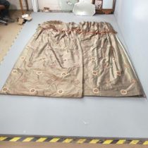 A pair of brown silk curtains, lined and interlined. Drop 239cm, Width (top) 158cm, (base) 246cm.