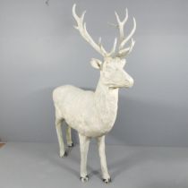 A modern fibreglass reindeer sculpture. Approximate dimensions 200x230x50cm. Generally good but worn