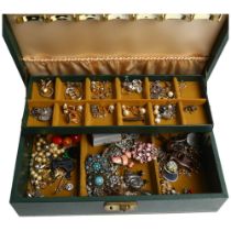 An assorted collection of various silver and other costume jewellery, in a cantilever jewellery box