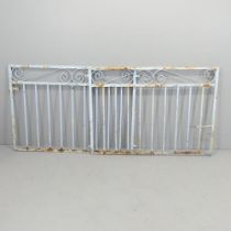 A pair of painted wrought iron gates. Each 126x87cm.