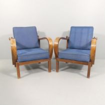 A pair of 1930s Art Deco reclining lounge chairs with bentwood arms.