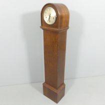 An early 20th century oak cased Grandmother clock, with 5" dial, named to James Walker ltd. of