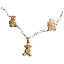 A pair of 9ct gold teddy bear design earrings, and similar 9ct gold teddy bear pendant and chain