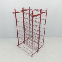 A painted metal wire-work bottle rack. 54x100x50cm.
