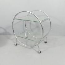 A contemporary Art Deco style two tier drinks trolley, with removable glass shelves and chrome