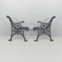 A pair of cast iron bench ends. Each 65x75cm.