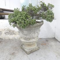 A weathered concrete garden urn. 50x50cm.