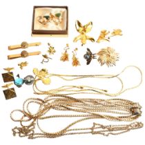 A quantity of gilt-metal costume jewellery, including items by Risis, floral design brooches,
