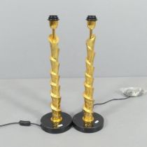 A pair of contemporary gold painted table lamps of spiral form, on granite bases. H - 58cm.