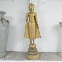 A gilt metal garden statue, study of an eastern figure. 40x122cm.
