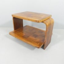 A 1930s two-tier Art Deco coffee table with geometric parquetry surfaces. 76x54x58.5cm.