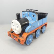 A Thomas the Tank Engine pedal car. 86x57x42cm. Has been left outside, and is showing some rust.