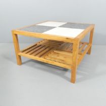 A Contemporary craftsman made square top coffee table, with inset Italian marble tiles on elm base