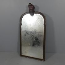 An eastern style wall mirror, with applied Chinese head mount. 69x140cm.