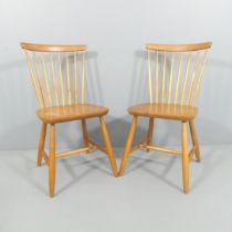 A pair of mid-century Swedish beech stick-back dining chairs. Good condition. Stamped Stocka to