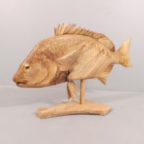 CLIVE FREDRIKSSON - A contemporary carved wooden sculpture on stand, study of a fish. 85x52x28cm.