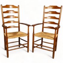 Lawrence Neal, Stockton, a pair of hand made Clisset Nr 2b armchairs in oak with rush seats,
