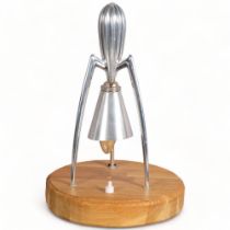 A Philippe Starck aluminium juicer, converted into a table lamp on oak base, 33cm Recently