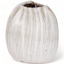 Yuriko Hill (1950-2013), a coconut shaped studio pottery vase with cream glaze, height 16cm Good