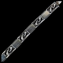 ERNST WILLY KNUDSEN - an Art Deco Danish sterling silver floral panel bracelet, 18.5cm, 35.1g No
