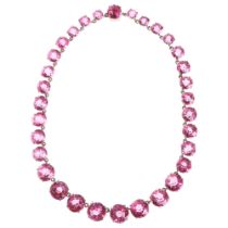 An Antique graduated pink paste Riviere necklace, paste ranging from 12.2-7.3mm, 36cm, 55.1g No
