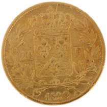 A French 1820 Louis XVIII gold twenty francs coin, 21mm, 6.3g High points quite heavily worn,