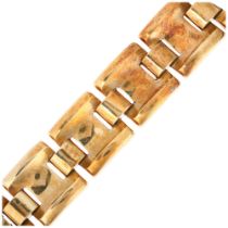 A heavy 18ct gold panel bracelet, maker LAO, import London 1975, concave and convex links, 18cm,