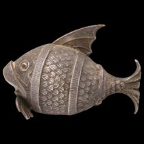 A Continental silver fish pepperette, apparently unmarked, 6.5cm High points slightly worn, tail