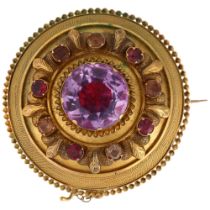 A Victorian foil-back amethyst memorial brooch, unmarked yellow metal settings, with rope twist