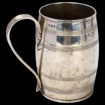 A George III silver barrel pint mug, with reeded decoration and acanthus leaf reeded handle,