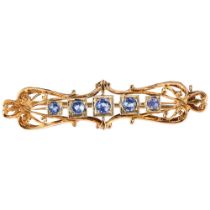 An Edwardian five stone sapphire openwork brooch, unmarked gold settings, 52.4mm, 5.4g No damage