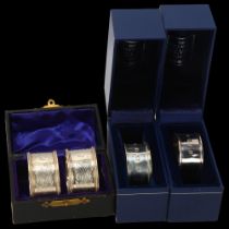 4 cased silver napkin rings, including millennium pair, 2.8oz total No damage or repair